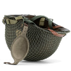 Casque complet parachutiste M1-C original avec sa coque McCord 884C et son liner Westinghouse, marquage 506th PIR 2nd bn NCO posé à l'envers avec son filet petites mailles monté.