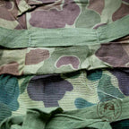 Gros plan sur le pacman du couvre casque moustiquaire camouflé USMC original