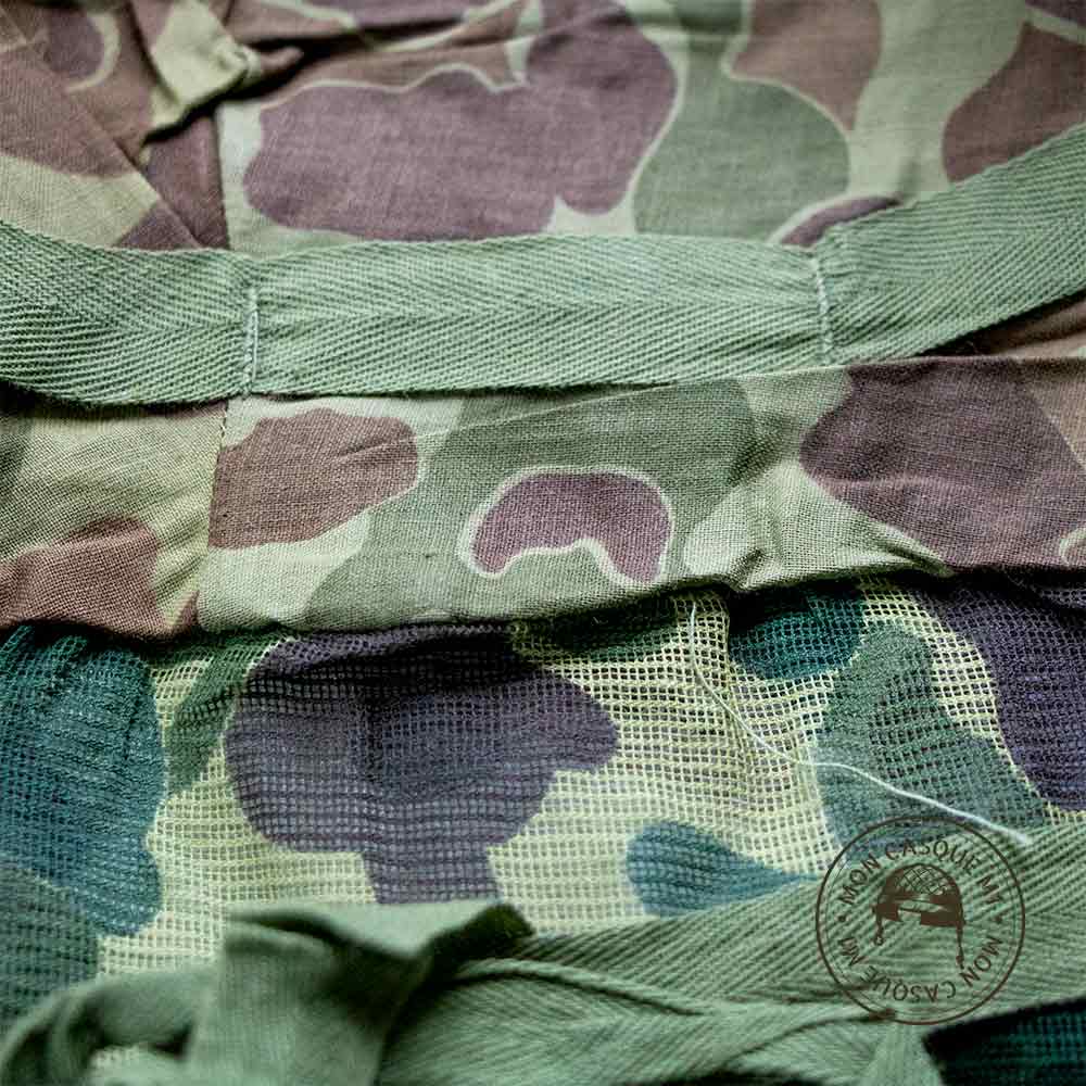 Gros plan sur le pacman du couvre casque moustiquaire camouflé USMC original